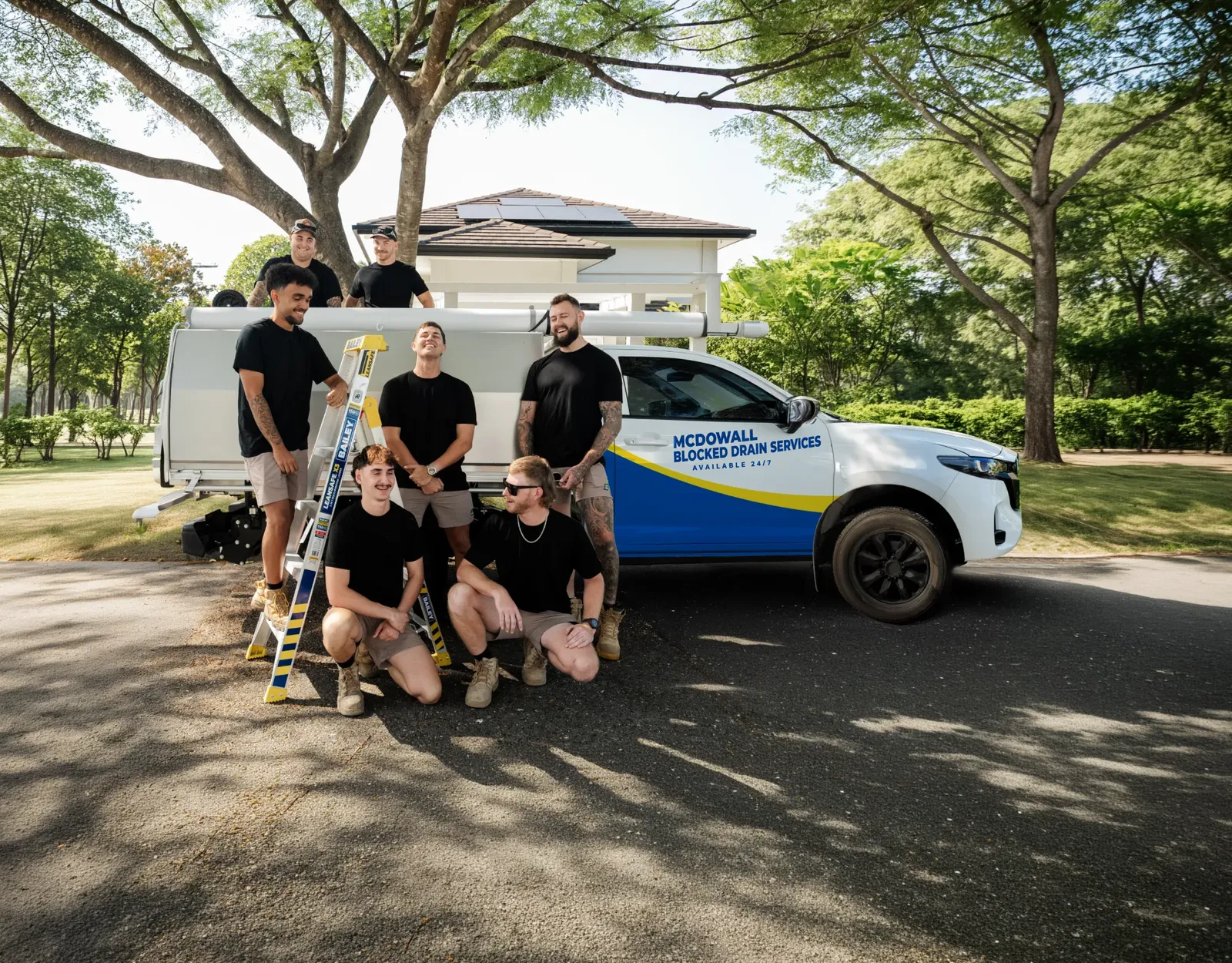 McDowall Blocked Drain Services ute and team