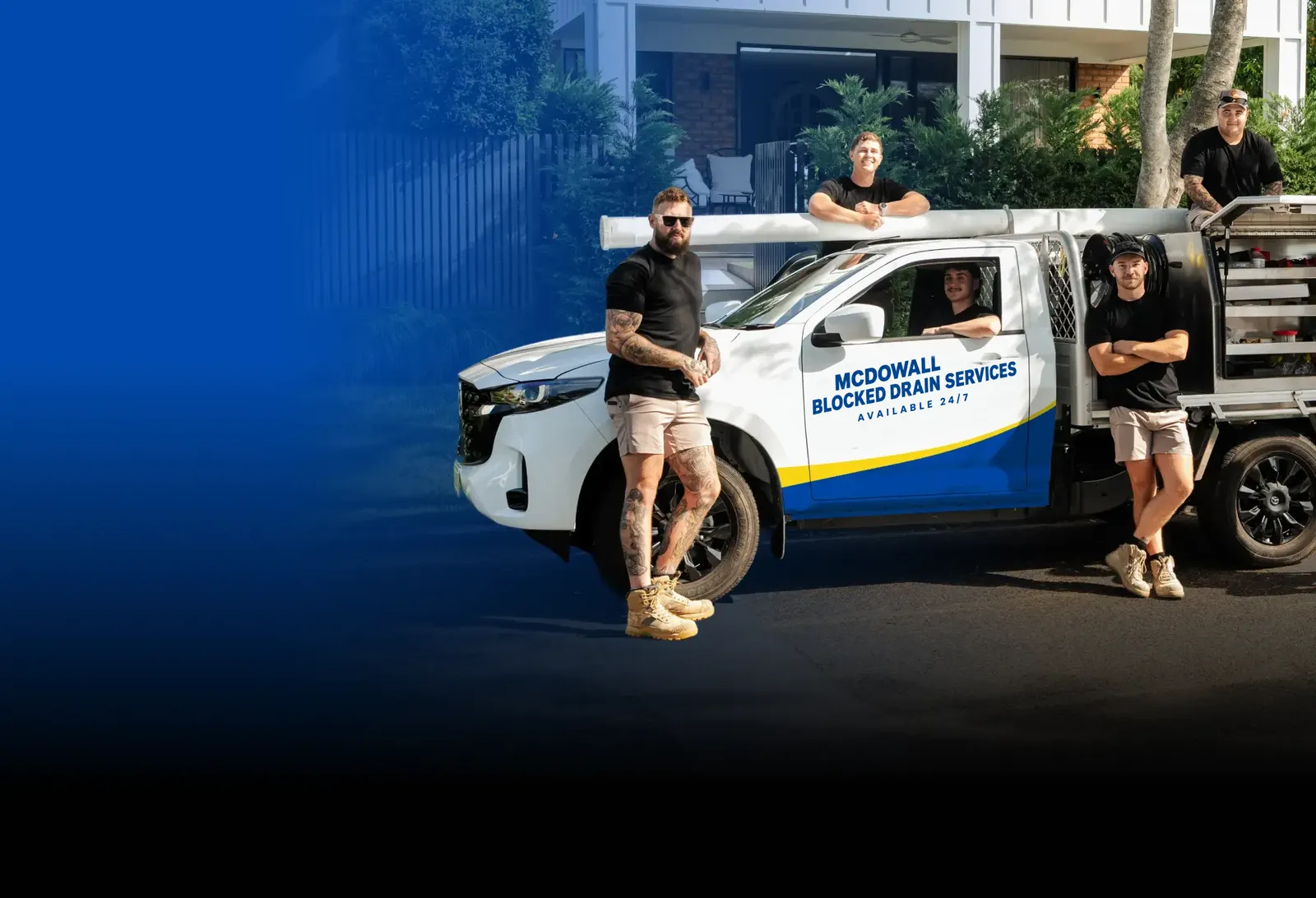 McDowall Blocked Drain Services team with the ute